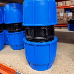 Selection of different irrigation connector types and pipe fittings for watering systems.